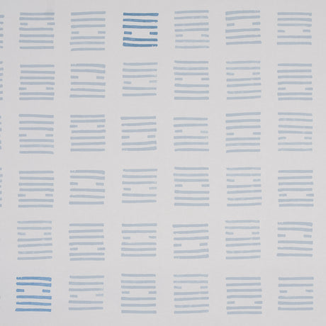 Tiasquam Sky by Caroline Z Hurley for Schumacher. Abstract hand-blocked look wallpaper in soft blue on white, shown in a modern living room setting.