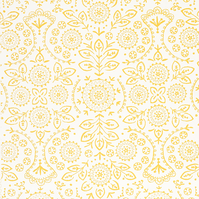 TIANA Yellow Bohemian Embroidered-Look Wallpaper by Schumacher, shown in a kitchen setting with gold fixtures and white shelving.