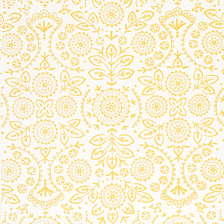 TIANA Yellow Bohemian Embroidered-Look Wallpaper by Schumacher, shown in a kitchen setting with gold fixtures and white shelving.