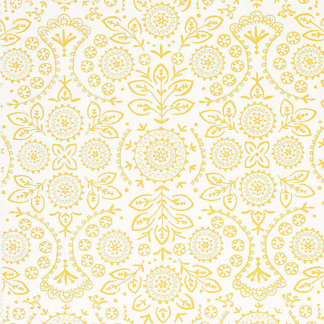 TIANA Yellow Bohemian Embroidered-Look Wallpaper by Schumacher, shown in a kitchen setting with gold fixtures and white shelving.