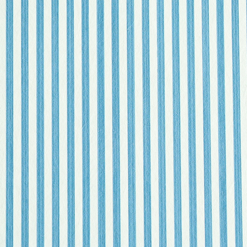 Edwin Stripe Narrow wallpaper in Ocean by Schumacher, featuring narrow blue and white vertical stripes.