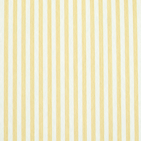 Edwin Stripe Narrow wallpaper in Buttercup by Schumacher, classic yellow and white narrow stripe wallcovering in a bright, sunlit room.
