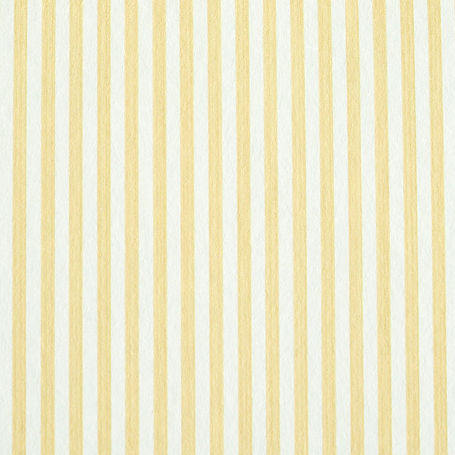 Edwin Stripe Narrow wallpaper in Buttercup by Schumacher, classic yellow and white narrow stripe wallcovering in a bright, sunlit room.