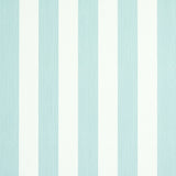 Edwin Stripe Medium wallpaper in Mineral by Schumacher, classic vertical stripe wallcovering in a serene blue and white colorway, styled in a bedroom setting.