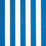 Edwin Stripe Medium navy blue and white striped wallpaper by Schumacher, shown in close-up and installed in a bedroom setting.