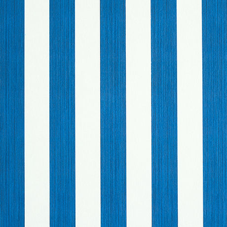 Edwin Stripe Medium navy blue and white striped wallpaper by Schumacher, shown in close-up and installed in a bedroom setting.
