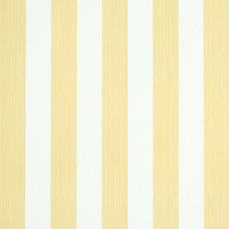 Edwin Stripe Medium wallpaper in Buttercup by Schumacher, classic yellow and white vertical stripes, shown in a styled bedroom and close-up views.