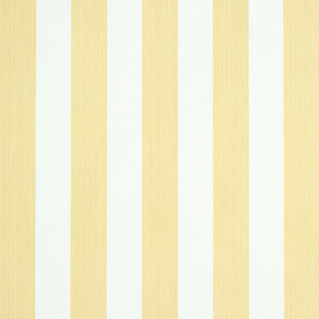 Edwin Stripe Medium wallpaper in Buttercup by Schumacher, classic yellow and white vertical stripes, shown in a styled bedroom and close-up views.