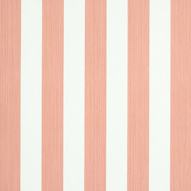 Edwin Stripe Medium wallpaper in pink and white, featuring classic vertical stripes with subtle texture, styled in a modern bedroom setting.