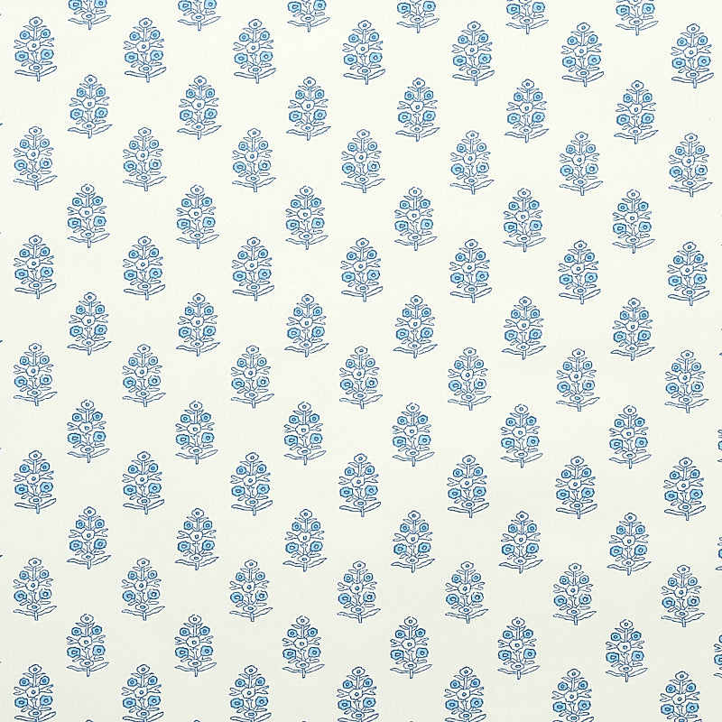 Aditi Blue stylized floral wallpaper by Schumacher, featuring petite bunches of hand-blocked style flowers on a light background.
