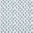 Beatriz Indigo by Schumacher, a diminutive printed floral wallpaper inspired by traditional indigo resist-dye techniques, shown in a bathroom setting.