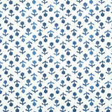 Beatriz Indigo by Schumacher, a diminutive printed floral wallpaper inspired by traditional indigo resist-dye techniques, shown in a bathroom setting.