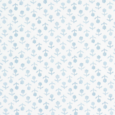 Beatriz Sky by Schumacher, a delicate blue floral wallpaper inspired by indigo resist-dye techniques, shown in a bathroom interior and as a roll.