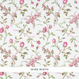 Magenta floral wallpaper with scattered roses and green leaves on a white background, Schumacher BELUZE