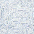 Galina wallpaper by Schumacher features a mosaic of abstract blue shapes reminiscent of antique tiles, shown in a modern bedroom setting.