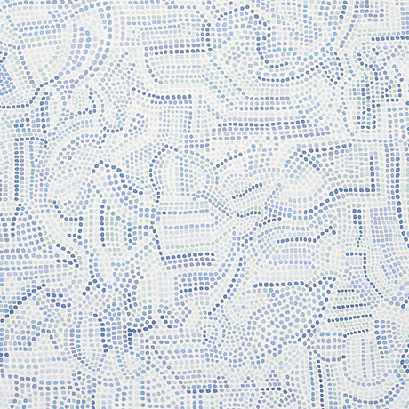 Galina wallpaper by Schumacher features a mosaic of abstract blue shapes reminiscent of antique tiles, shown in a modern bedroom setting.