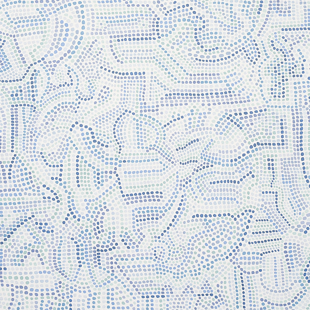 Galina wallpaper by Schumacher features a mosaic of abstract blue shapes reminiscent of antique tiles, shown in a modern bedroom setting.