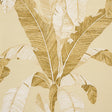 Large-scale neutral banana leaf wallpaper from Schumacher's Copacabana collection, shown in a styled interior setting.