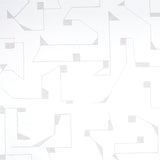 Circuit wallpaper in grey by Schumacher, abstract geometric line pattern, styled in a modern bedroom interior.