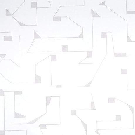Circuit wallpaper in grey by Schumacher, abstract geometric line pattern, styled in a modern bedroom interior.