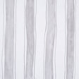Tracing Stripes wallpaper in grey by Porter Teleo for Schumacher, featuring hand-painted vertical stripes in a modern bedroom setting.