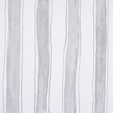 Tracing Stripes wallpaper in grey by Porter Teleo for Schumacher, featuring hand-painted vertical stripes in a modern bedroom setting.