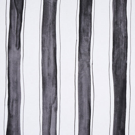 Tracing Stripes wallpaper by Schumacher, featuring bold hand-painted black vertical stripes with delicate tracing on a white background.