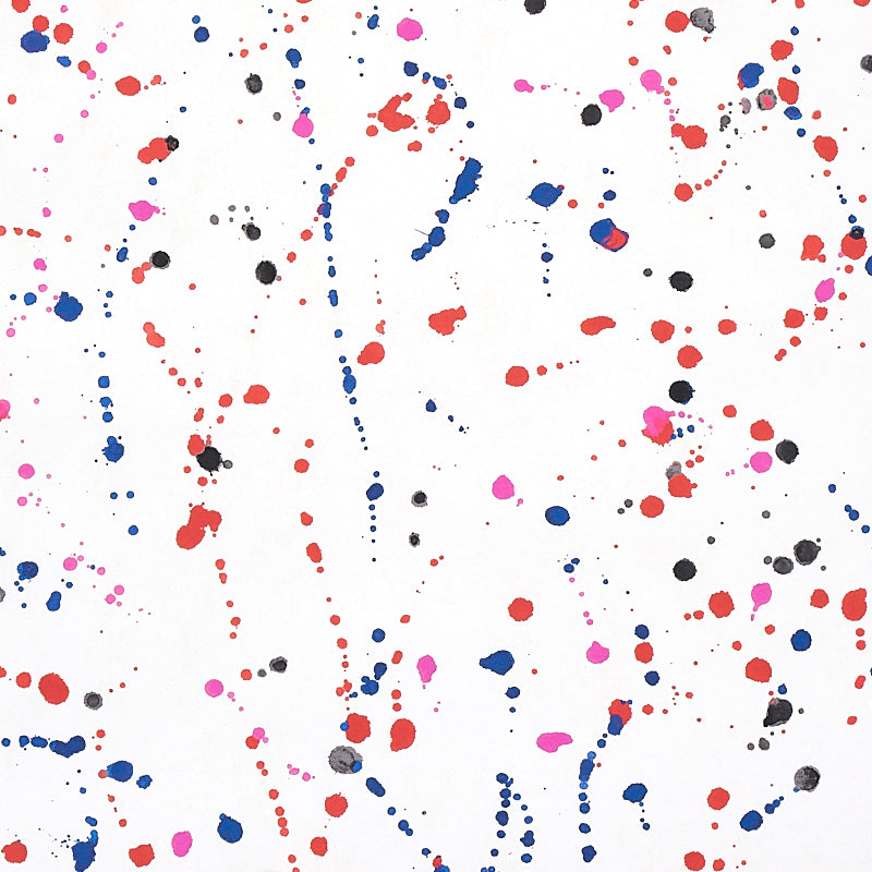 INK SPLASH wallpaper by Schumacher, featuring a painterly abstract pattern in red and blue on a white background.