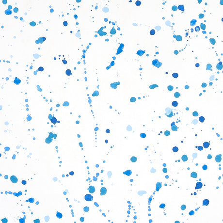 Blue ink splash abstract wallpaper by Schumacher, designed by Porter Teleo, shown in a modern interior setting.