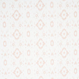 Tabitha Quiet Pink by Schumacher - Soft geometric ikat-inspired wallpaper in pale pink and white, shown in detail and installed in a bathroom.