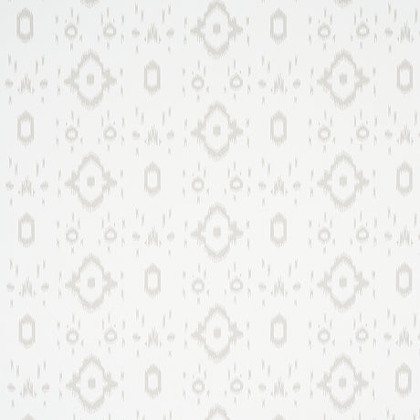 Tabitha Soft Grey by Schumacher - a subtle ikat-inspired geometric wallpaper in a light neutral colorway, shown in a bathroom setting.