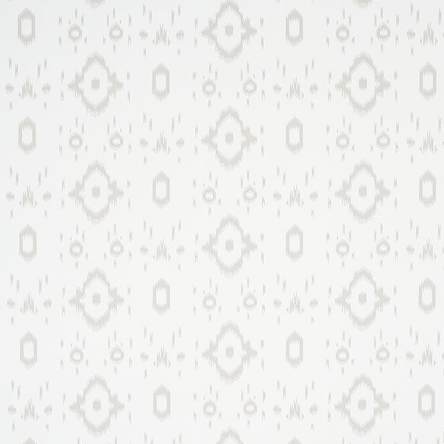 Tabitha Soft Grey by Schumacher - a subtle ikat-inspired geometric wallpaper in a light neutral colorway, shown in a bathroom setting.