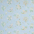 Magical Menagerie wallpaper in sky blue with whimsical birds, flowers, and fauna, styled in a bedroom setting by Schumacher.