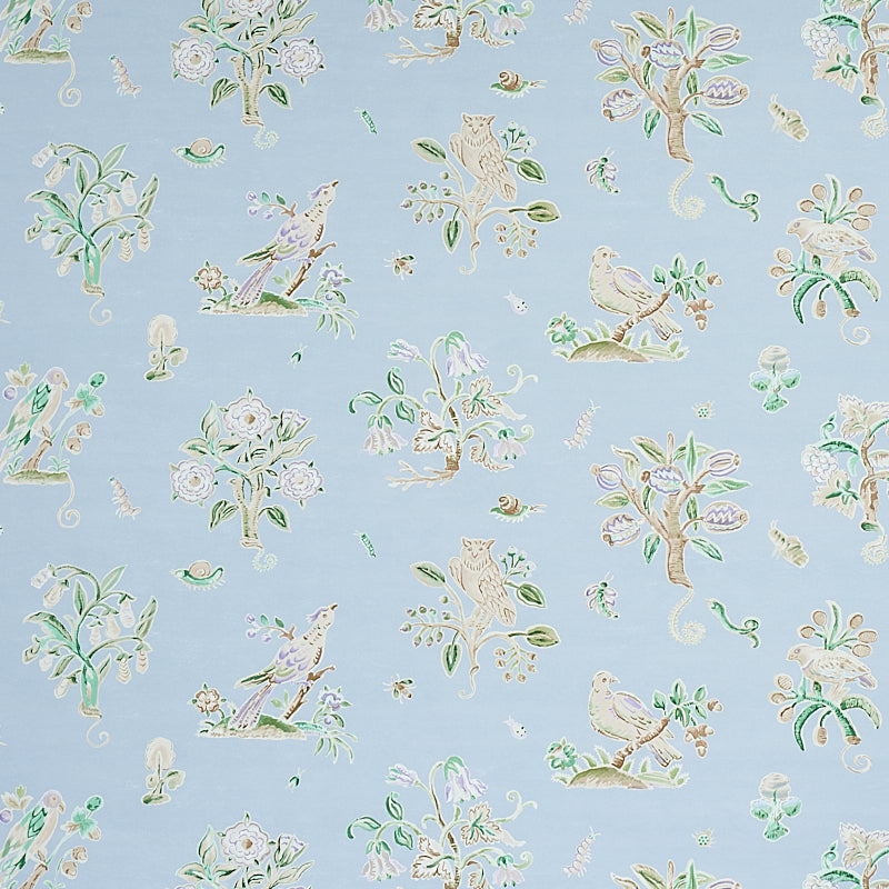 Magical Menagerie wallpaper in sky blue with whimsical birds, flowers, and fauna, styled in a bedroom setting by Schumacher.