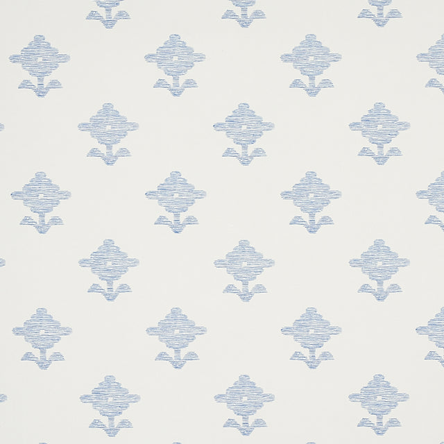 Rubia blue wallpaper with stylized floral motifs and subtle metallic sheen, shown in a bathroom setting.