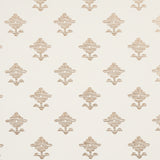Rubia Ivory wallpaper by Schumacher featuring stylized floral motifs with fine linework and a subtle metallic sheen, shown in a bathroom setting.