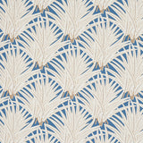 Zenada blue botanical palm leaf wallpaper from the Copacabana collection by Schumacher, shown in a styled bedroom setting.