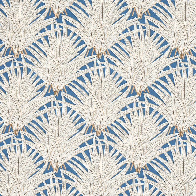 Zenada blue botanical palm leaf wallpaper from the Copacabana collection by Schumacher, shown in a styled bedroom setting.