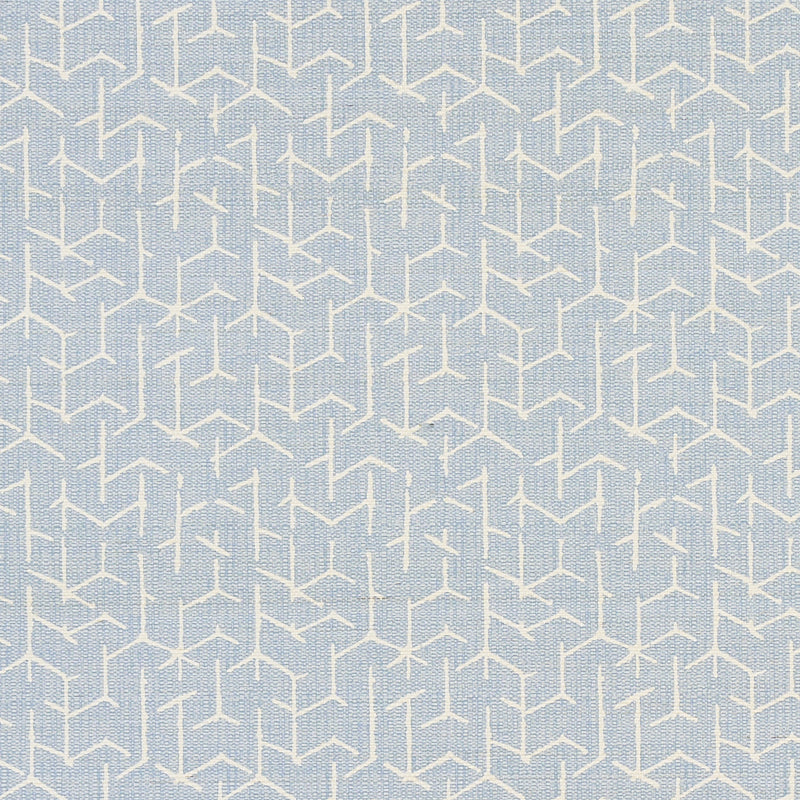 Coleridge Chambray by Schumacher - geometric blue and white wallpaper with a woven fabric texture, shown in a modern living room setting.