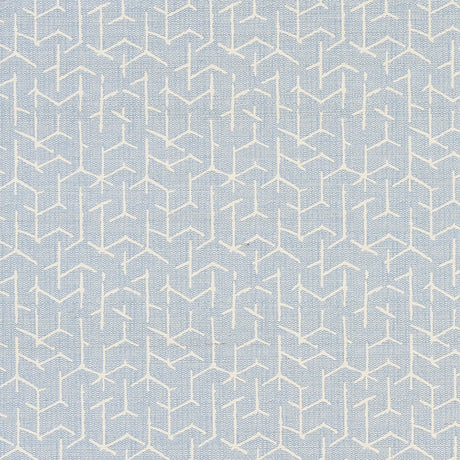 Coleridge Chambray by Schumacher - geometric blue and white wallpaper with a woven fabric texture, shown in a modern living room setting.