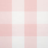 Willa Check Large in pink by Schumacher, a playful oversized gingham plaid wallpaper shown in a styled bedroom and detail views.