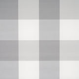 Willa Check Large grey plaid wallpaper by Schumacher, extra-large-scale gingham pattern, shown in a modern bedroom setting.