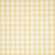 Willa Check Small yellow gingham plaid wallpaper by Schumacher shown in close-up and installed in a bright kitchen interior.