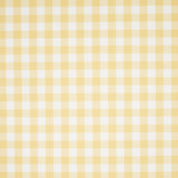 Willa Check Small yellow gingham plaid wallpaper by Schumacher shown in close-up and installed in a bright kitchen interior.