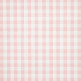 Willa Check Small pink gingham plaid wallpaper by Schumacher, shown in detail and installed in a bright kitchen setting.