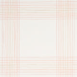 Minerva Plaid pink plaid wallpaper with a soft ombré effect, hand-painted watercolor look, styled in a modern bedroom setting.