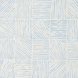 Katama blue on ivory linear block pattern wallpaper by Caroline Z Hurley for Schumacher, shown in a modern interior setting.