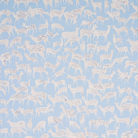 Slate blue wallpaper with hand-drawn white deer in a small-scale, whimsical pattern. Schumacher FAUNA 5012490.