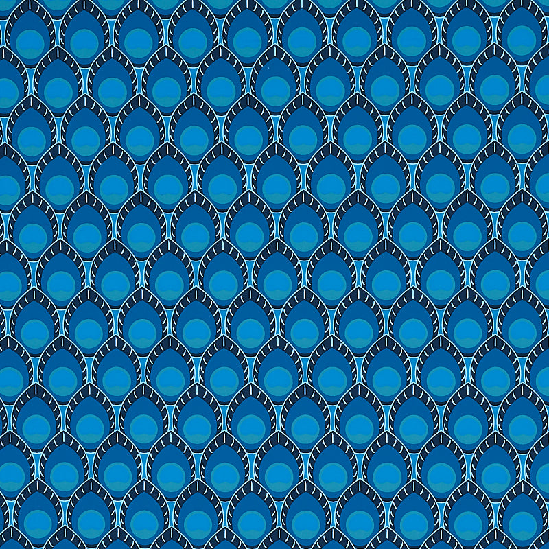Dawnridge Peacock wallpaper by Schumacher, featuring a bold blue and teal peacock feather-inspired geometric pattern, shown in a styled interior and close-up views.