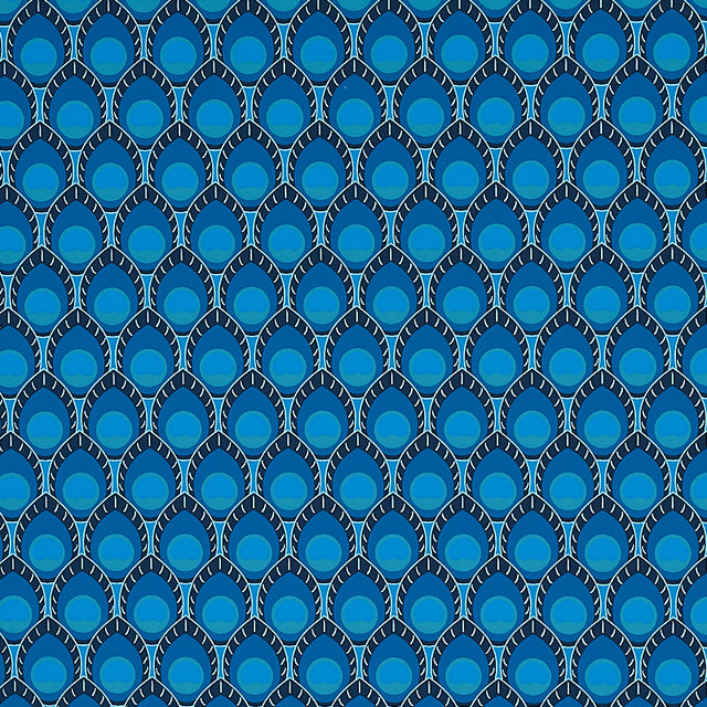 Dawnridge Peacock wallpaper by Schumacher, featuring a bold blue and teal peacock feather-inspired geometric pattern, shown in a styled interior and close-up views.